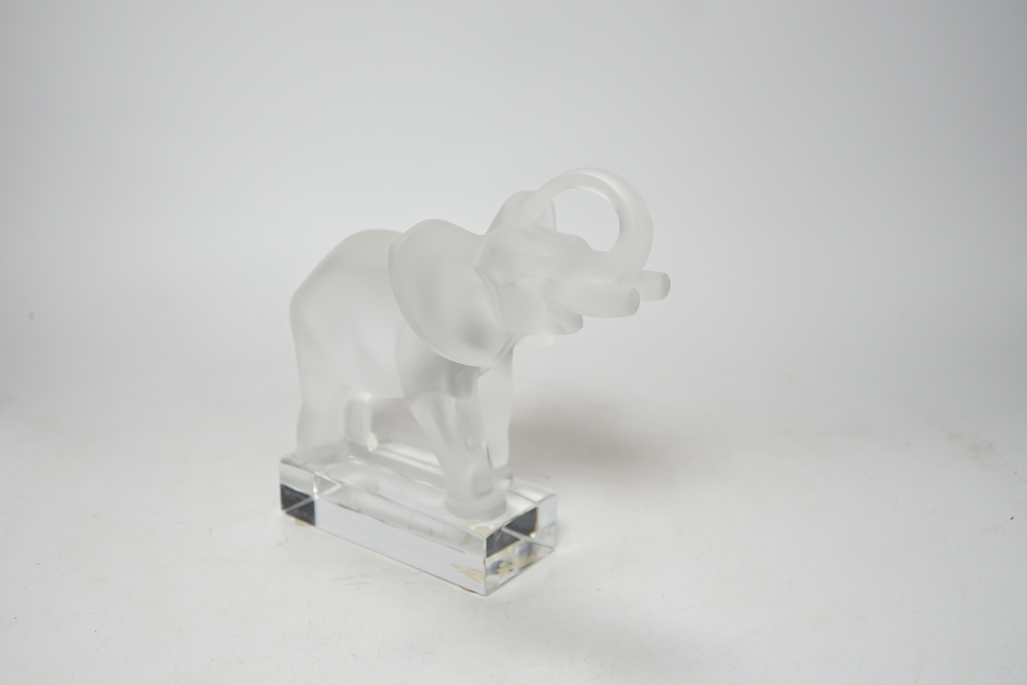 A Lalique frosted glass model of an elephant, signed to the base, 16cm high